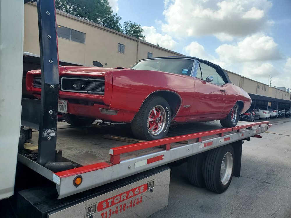 Red classic muscle car on a flatbed - AA Affordable Towing
