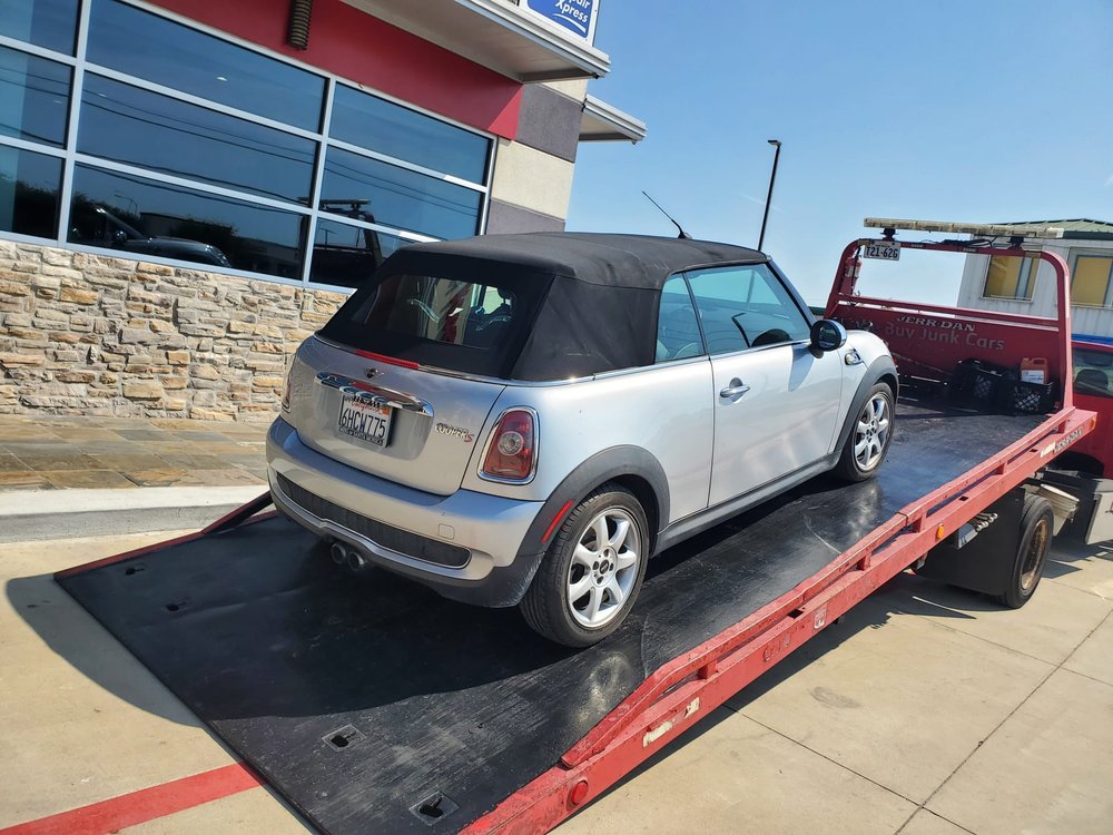 Silver Mini convertible on a flatbed - AA Affordable Towing