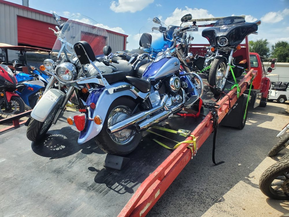 Blue motorcycles strapped down for transport - AA Affordable Towing